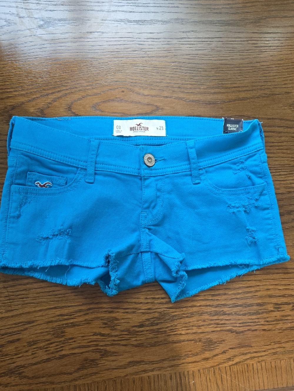 Hollister Women's Vibrant Turquoise Distressed Denim Shortie